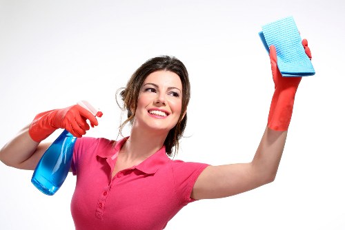 Technician using PPE during carpet cleaning in Knightsbridge